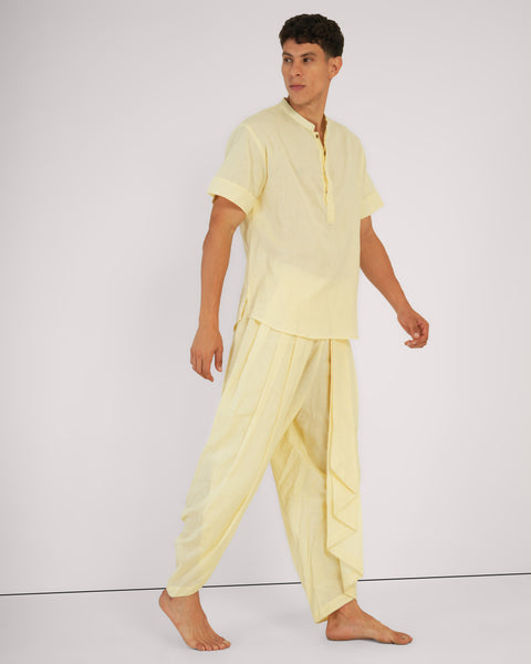 Side view of dhoti-inspired cotton pants and kurta in pale yellow, designed for comfort and breathability.