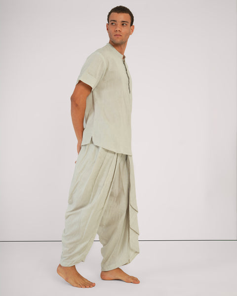 Side profile of model in Vibhuti Grey Yoga Outfit by Shanti Chola, featuring a relaxed fit and flowy silhouette in Linen Cotton Blend fabric.