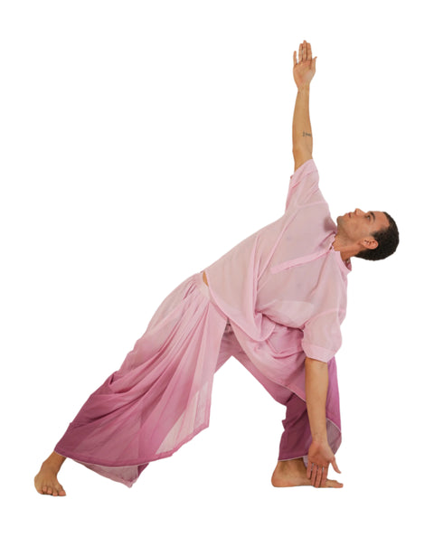 Man in Anahata Pink ombre YogaFlow set doing yoga asana— 100% cotton, breathable yoga clothing inspired by softness, heart energy, and grace.