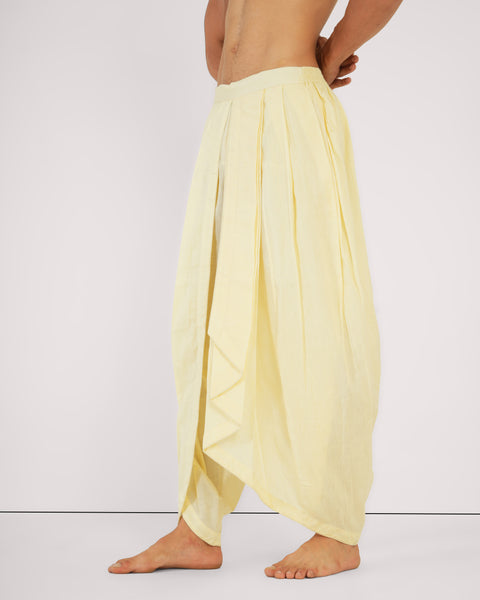 Yellow dhoti-style yoga pants in breathable cotton, natural drape for meditation or mindful movement.