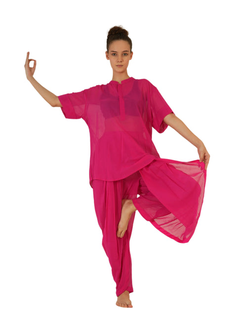 Woman in vibrant fuchsia YogaFlow set — 100% cotton yoga wear, breathable and bold, designed for presence, power, and poise.