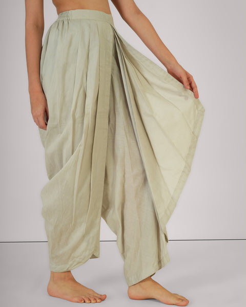Side view of female demonstrating drape of Vibhuti Grey linen cotton yoga pants, breathable natural fabric, white studio background.